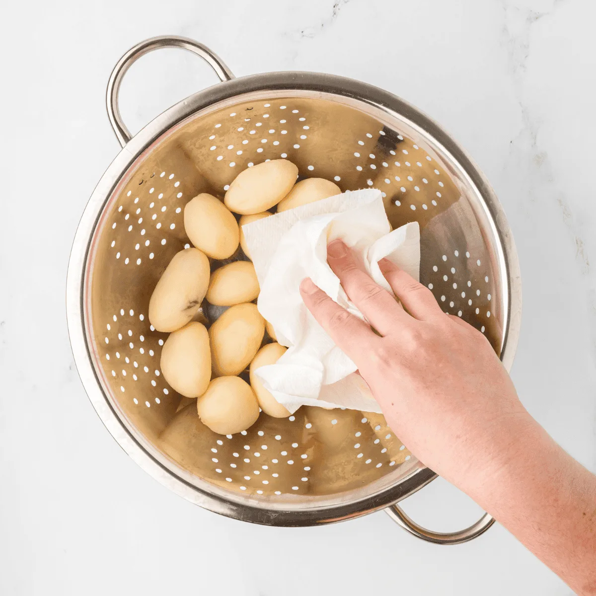 draining and drying canned potatoes