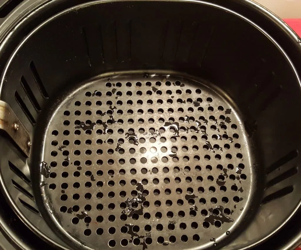 how to season an air fryer basket if the manual allows it
